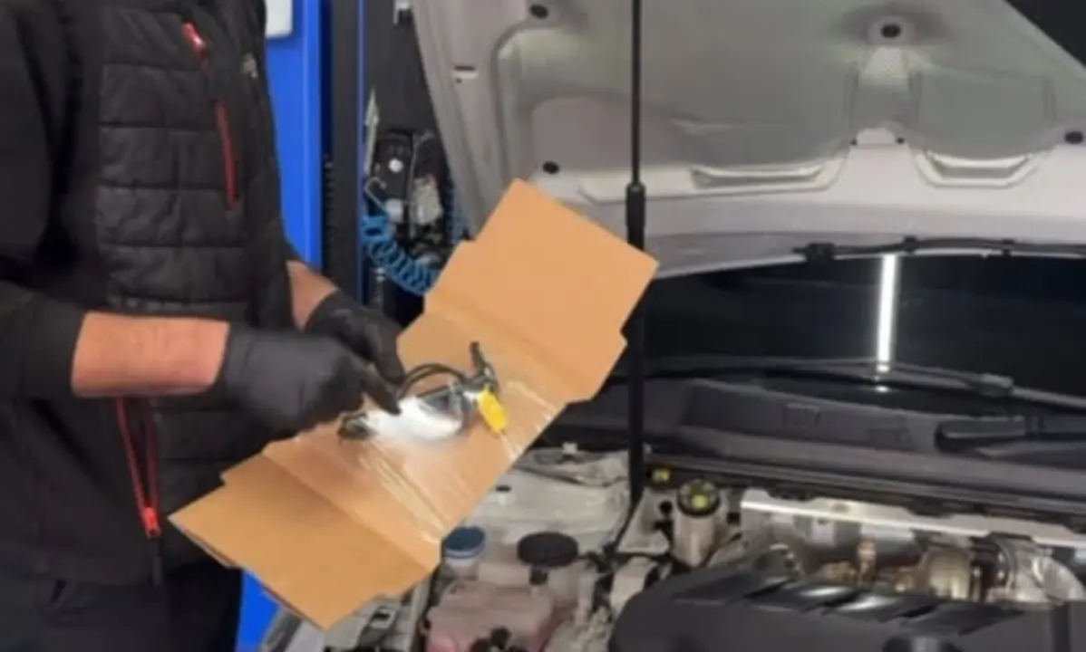 TMC Motors technician diagnosing an active bonnet sensor fault