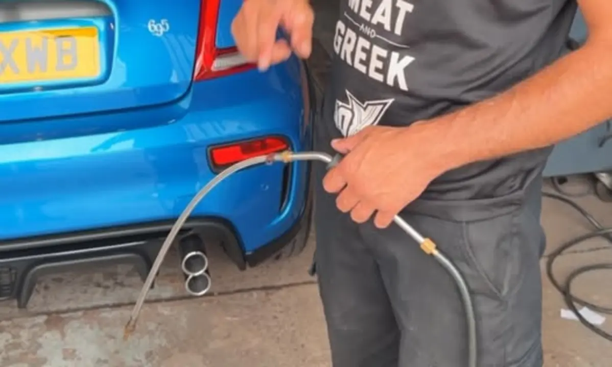 Team Mercedes Cardiff technician carrying out an MOT emissions check